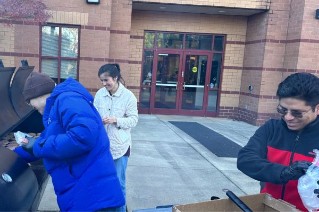 staff grilling outside